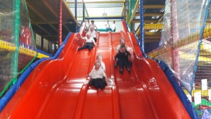 Whizzing down the slide together!